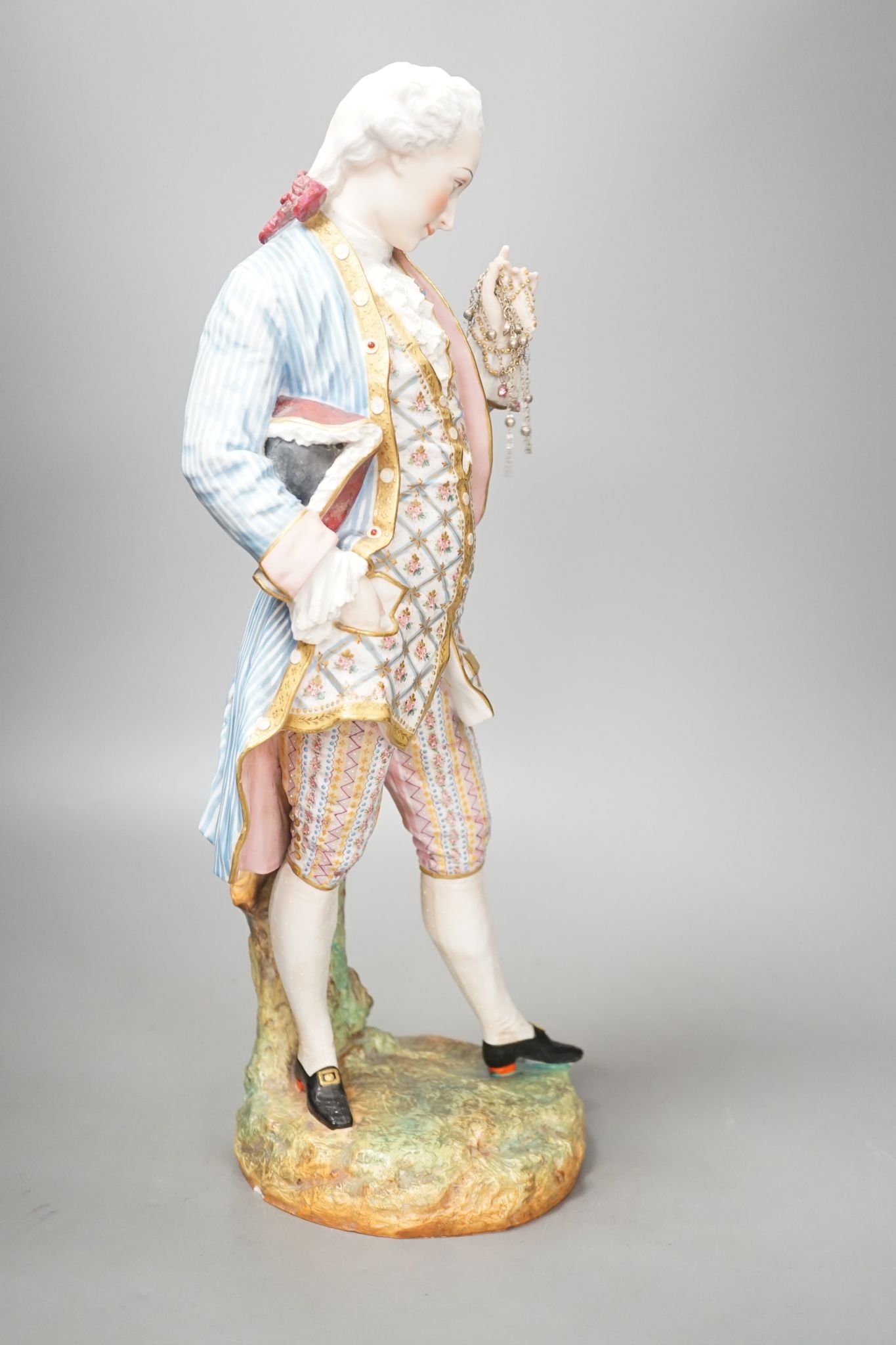 A large French coloured biscuit figure of a gentleman 42cm